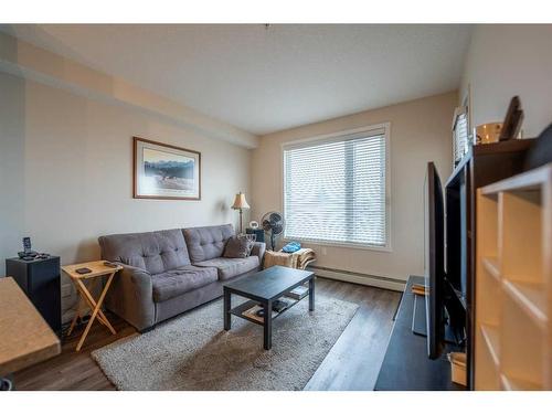 212-30 Shawnee Common Sw, Calgary, AB - Indoor Photo Showing Living Room