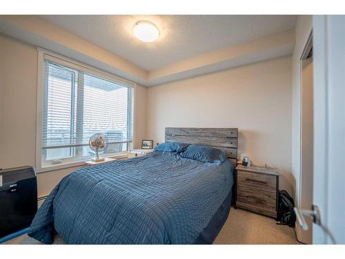 212-30 Shawnee Common Sw, Calgary, AB - Indoor Photo Showing Bedroom