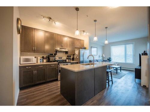 212-30 Shawnee Common Sw, Calgary, AB - Indoor Photo Showing Kitchen With Upgraded Kitchen