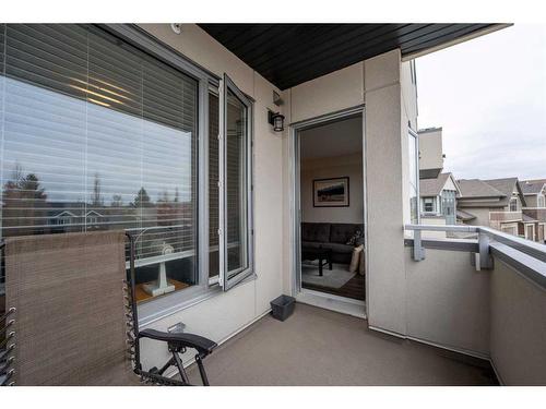 212-30 Shawnee Common Sw, Calgary, AB - Outdoor With Balcony With Exterior