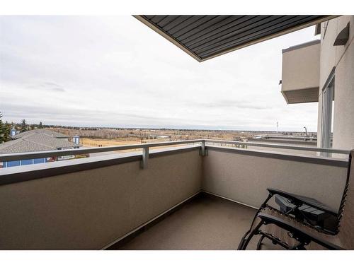 212-30 Shawnee Common Sw, Calgary, AB - Outdoor With Balcony With View With Exterior