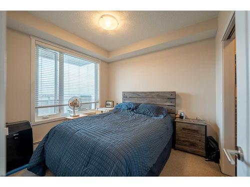 212-30 Shawnee Common Sw, Calgary, AB - Indoor Photo Showing Bedroom