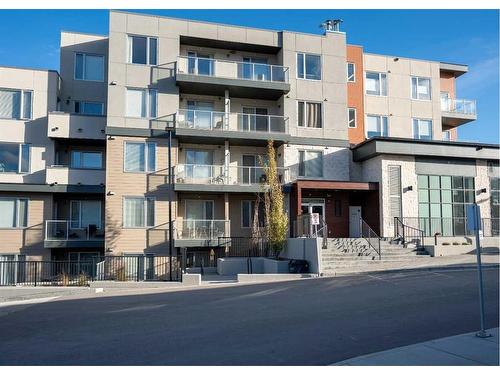 212-30 Shawnee Common Sw, Calgary, AB - Outdoor With Balcony With Facade