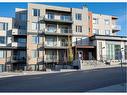 212-30 Shawnee Common Sw, Calgary, AB  - Outdoor With Balcony With Facade 