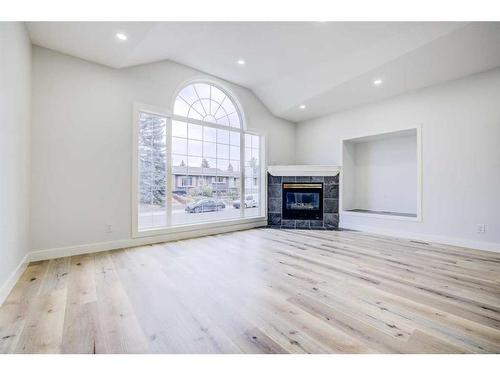 1435 42 Street Ne, Calgary, AB - Indoor Photo Showing Other Room With Fireplace