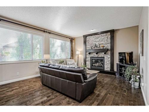 149 Cranridge Terrace Se, Calgary, AB - Indoor Photo Showing Living Room With Fireplace