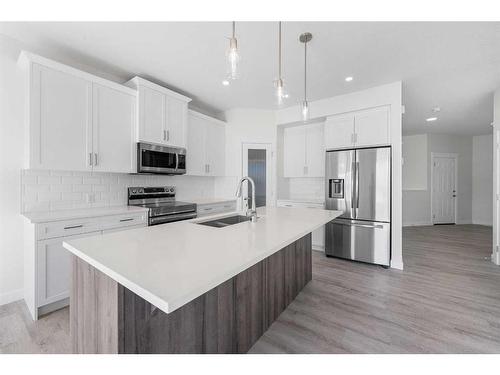 696 Reynolds Crescent Sw, Airdrie, AB - Indoor Photo Showing Kitchen With Stainless Steel Kitchen With Double Sink With Upgraded Kitchen