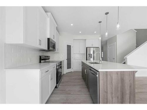 696 Reynolds Crescent Sw, Airdrie, AB - Indoor Photo Showing Kitchen With Stainless Steel Kitchen With Upgraded Kitchen