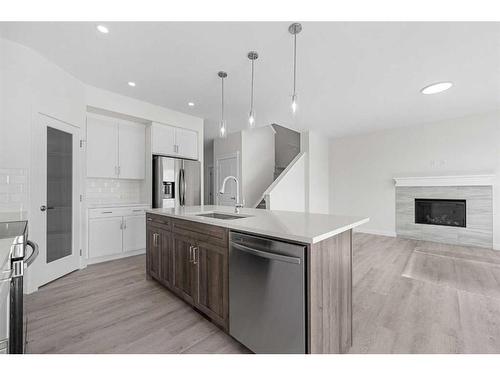 696 Reynolds Crescent Sw, Airdrie, AB - Indoor Photo Showing Kitchen With Stainless Steel Kitchen With Upgraded Kitchen