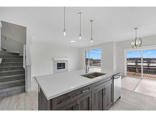 696 Reynolds Crescent Sw, Airdrie, AB - Indoor Photo Showing Kitchen With Double Sink