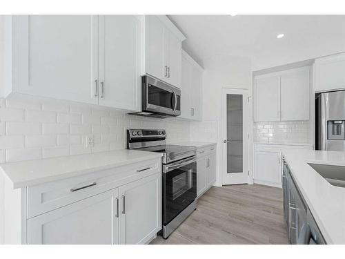 696 Reynolds Crescent Sw, Airdrie, AB - Indoor Photo Showing Kitchen With Stainless Steel Kitchen With Upgraded Kitchen