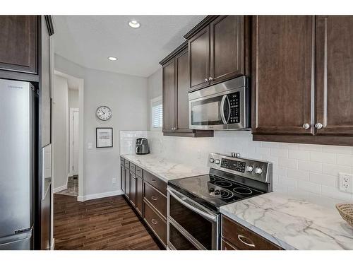 18 Chaparral Valley Place Se, Calgary, AB - Indoor Photo Showing Kitchen With Stainless Steel Kitchen With Upgraded Kitchen