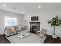 18 Chaparral Valley Place Se, Calgary, AB  - Indoor Photo Showing Living Room With Fireplace 