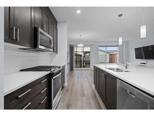 6 Sage Bluff Heights Nw, Calgary, AB - Indoor Photo Showing Kitchen With Stainless Steel Kitchen With Double Sink With Upgraded Kitchen