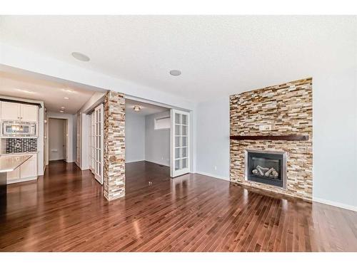 176 Evansridge Circle Nw, Calgary, AB - Indoor Photo Showing Living Room With Fireplace