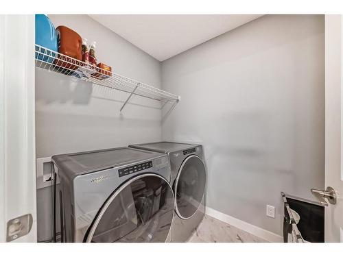 161 Seton Villas Se, Calgary, AB - Indoor Photo Showing Laundry Room