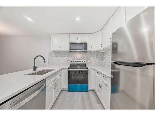 161 Seton Villas Se, Calgary, AB - Indoor Photo Showing Kitchen With Double Sink With Upgraded Kitchen