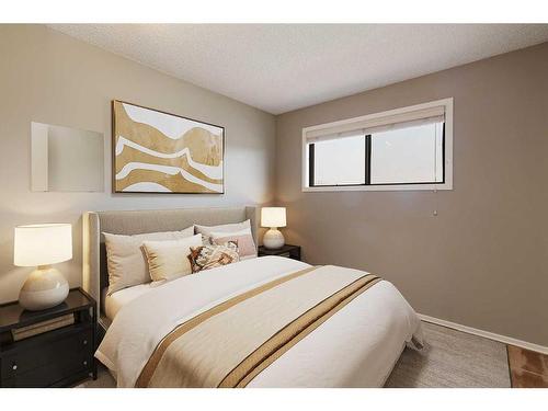 303 Lynnview Road Se, Calgary, AB - Indoor Photo Showing Bedroom