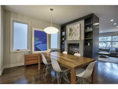 2029 31 Street Sw, Calgary, AB - Indoor Photo Showing Dining Room With Fireplace