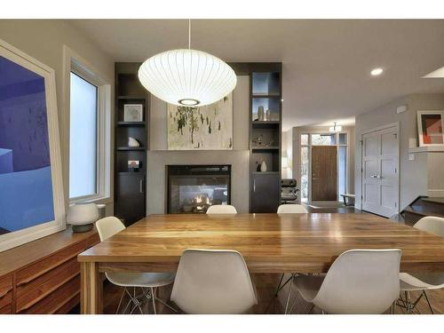 2029 31 Street Sw, Calgary, AB - Indoor Photo Showing Dining Room With Fireplace