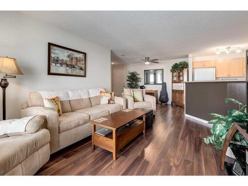 1408-10 Prestwick Bay Se, Calgary, AB - Indoor Photo Showing Living Room