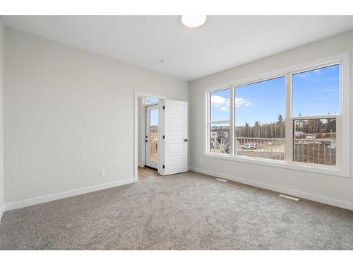 348 Rivercrest View, Cochrane, AB - Indoor Photo Showing Other Room