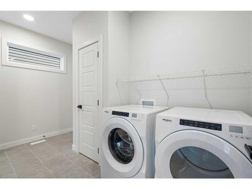 348 Rivercrest View, Cochrane, AB - Indoor Photo Showing Laundry Room