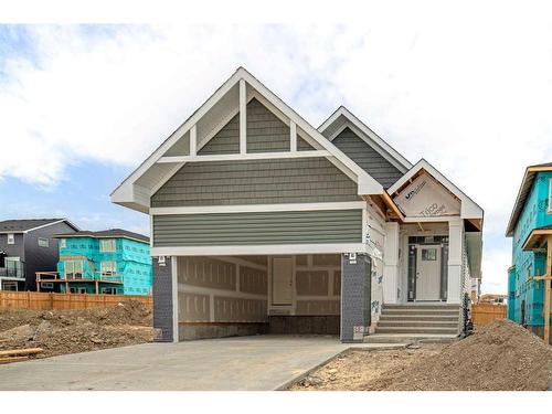 348 Rivercrest View, Cochrane, AB - Outdoor With Facade