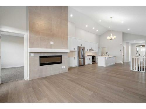 348 Rivercrest View, Cochrane, AB - Indoor With Fireplace