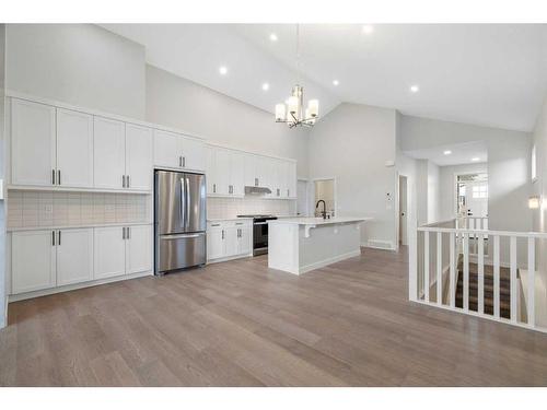 348 Rivercrest View, Cochrane, AB - Indoor Photo Showing Kitchen With Stainless Steel Kitchen With Upgraded Kitchen