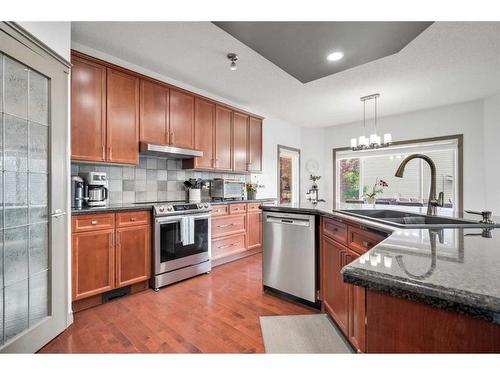 90 Rockyspring Circle Nw, Calgary, AB - Indoor Photo Showing Kitchen With Stainless Steel Kitchen With Double Sink