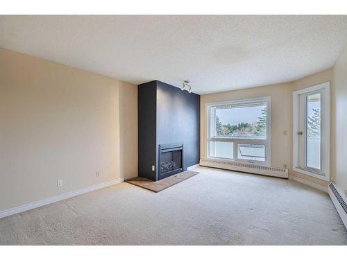 403-3747 42 Street Nw, Calgary, AB - Indoor With Fireplace