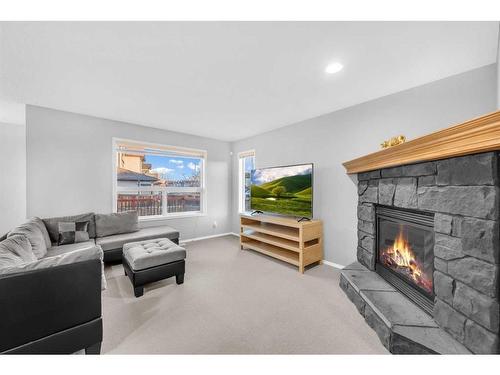 165 Brightondale Parade Se, Calgary, AB - Indoor Photo Showing Living Room With Fireplace