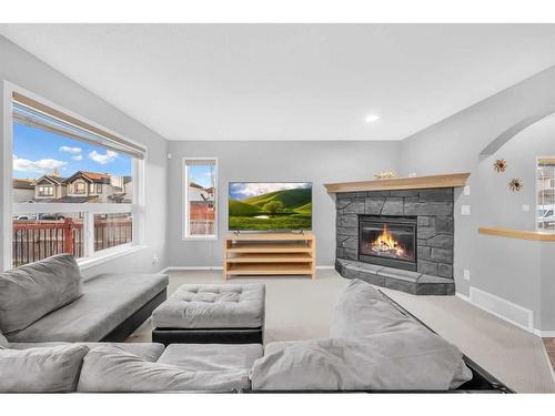 165 Brightondale Parade Se, Calgary, AB - Indoor Photo Showing Living Room With Fireplace