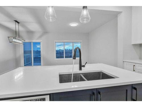 223 Willow Place, Cochrane, AB - Indoor Photo Showing Kitchen With Double Sink