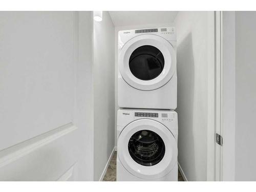 223 Willow Place, Cochrane, AB - Indoor Photo Showing Laundry Room