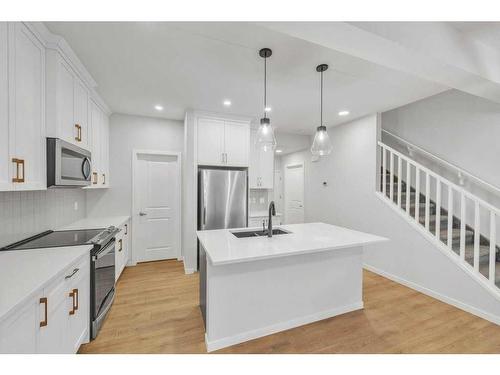 223 Willow Place, Cochrane, AB - Indoor Photo Showing Kitchen With Stainless Steel Kitchen With Upgraded Kitchen