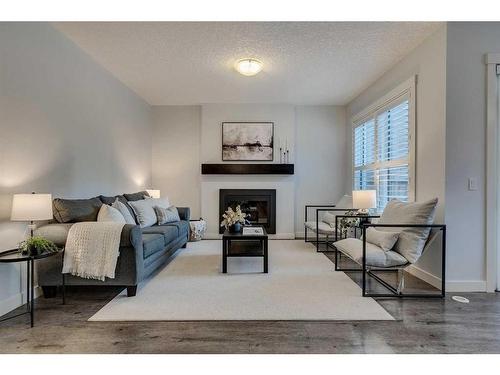 169 Cranarch Common Se, Calgary, AB - Indoor Photo Showing Living Room With Fireplace