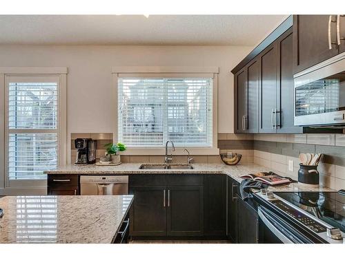 169 Cranarch Common Se, Calgary, AB - Indoor Photo Showing Kitchen With Upgraded Kitchen