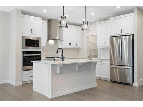 275 Rivercrest Way, Cochrane, AB - Indoor Photo Showing Kitchen With Stainless Steel Kitchen With Upgraded Kitchen