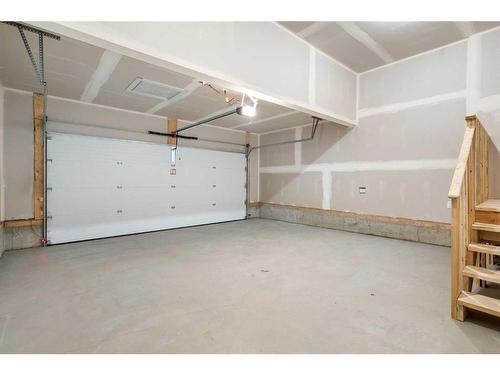 275 Rivercrest Way, Cochrane, AB - Indoor Photo Showing Garage