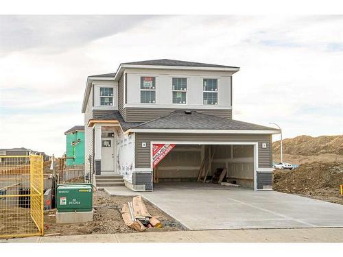 275 Rivercrest Way, Cochrane, AB - Outdoor With Facade