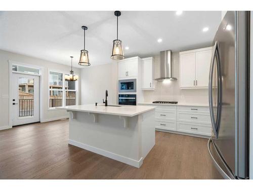 275 Rivercrest Way, Cochrane, AB - Indoor Photo Showing Kitchen With Stainless Steel Kitchen With Upgraded Kitchen