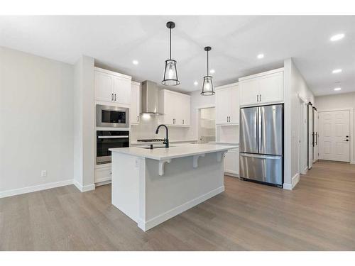 275 Rivercrest Way, Cochrane, AB - Indoor Photo Showing Kitchen With Stainless Steel Kitchen With Upgraded Kitchen