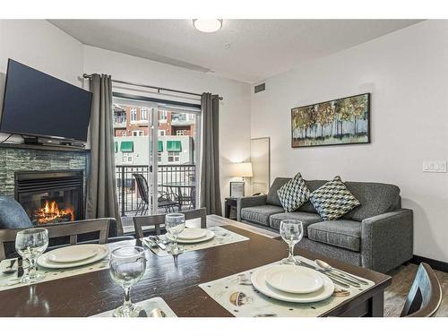 241-901 Mountain Street, Canmore, AB - Indoor Photo Showing Living Room With Fireplace