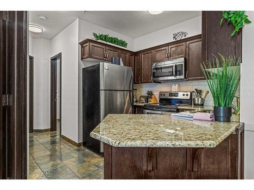 241-901 Mountain Street, Canmore, AB - Indoor Photo Showing Kitchen With Stainless Steel Kitchen