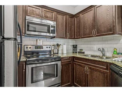 241-901 Mountain Street, Canmore, AB - Indoor Photo Showing Kitchen With Stainless Steel Kitchen With Double Sink