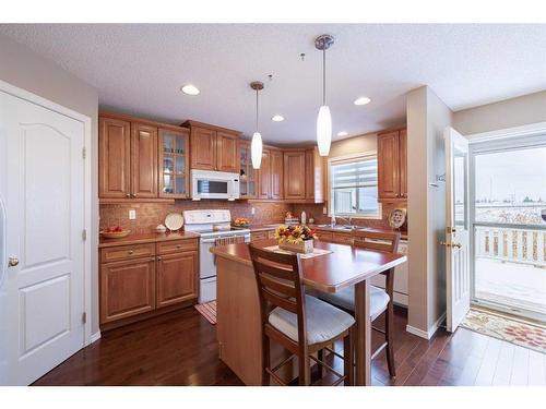 107 Arbour Meadows Close Nw, Calgary, AB - Indoor Photo Showing Kitchen With Double Sink