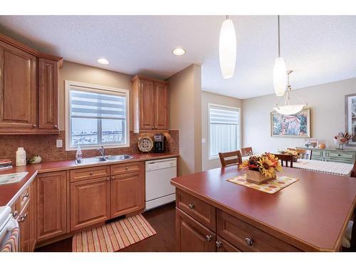 107 Arbour Meadows Close Nw, Calgary, AB - Indoor Photo Showing Kitchen With Double Sink