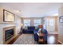 107 Arbour Meadows Close Nw, Calgary, AB  - Indoor Photo Showing Living Room With Fireplace 